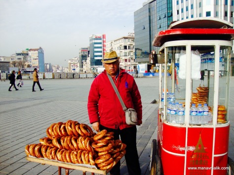 A vendor selling Simits or sesame breads